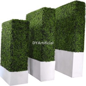 artificial hedge in shades of green